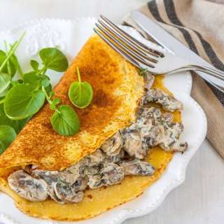 Socca (chickpea flour) crepes with creamy mushroom filling