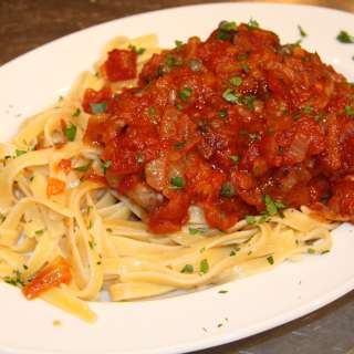 Swordfish with Wine, Tomatoes, Capers and Fettuccine.