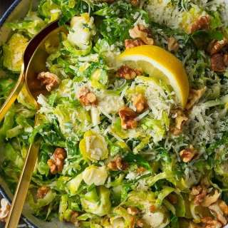 Shredded Brussels Sprout Salad with Romano Cheese Toasted Walnuts and Lemon Vinaigrette