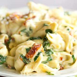 Tortellini with Spinach and Sun-Dried Tomatoes in a Garlic-Parmesan Cream Sauce