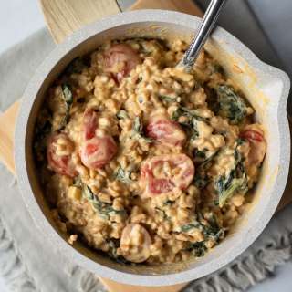 Cheesy Vegan Farro With Tomatoes and Kale