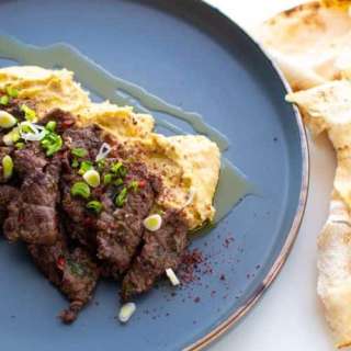 Thinly Sliced Ribeye with Hummus and Capers