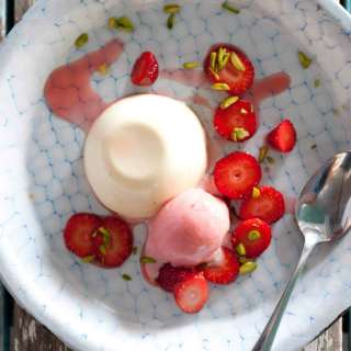 White Chocolate Panna Cotta w/ Strawberry Sorbet & Pistachios