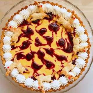 White Chocolate & Mango Tart with Raspberry Coulis
