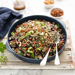 Nutty black & white rice salad with peppers & raisins & ginger, soya honey dressing