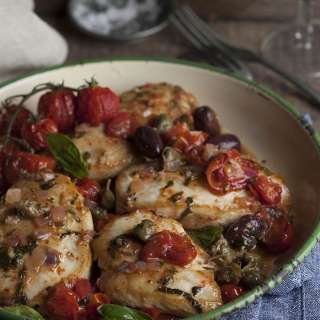 Lightly roasted chicken breasts with a tomato, olive and caper salsa