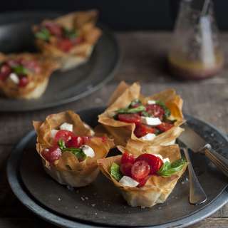 caprese salad in phyllo baskets with an olive tapenade vinaigrette