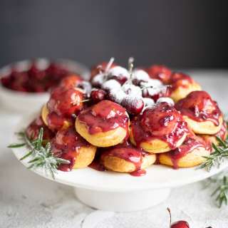 Profiterole wreath with cherries