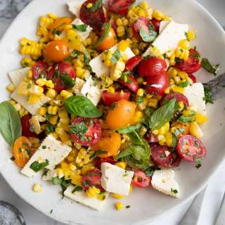 Corn salad with tomatoes, feta, and herbs
