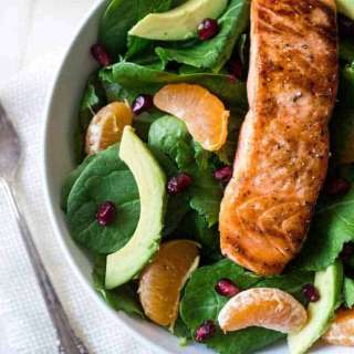 Kale Salad Recipe with Salmon, Pomegranate and Orange Coconut Vinaigrette