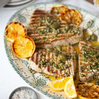 Seared tuna steaks with lemon, caper and parsley butter