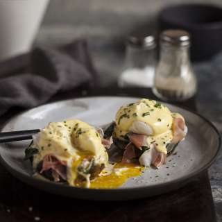 Eggs benedict on roasted brown mushrooms