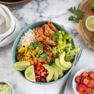 Chipotle chicken burrito bowl with avocado & lime crema