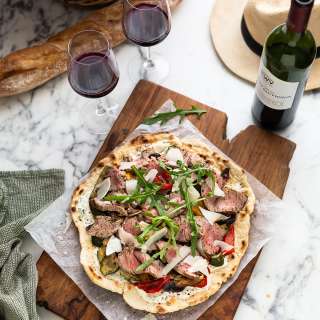 Crispy flatbread with Mediterranean roasted vegetables & steak