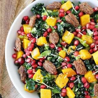 Kale and Brussels Sprouts Salad with Butternut Squash, Pomegranate, and Candied Pecans
