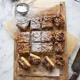 Gooey oat bars with fruit, nuts, and dark chocolate