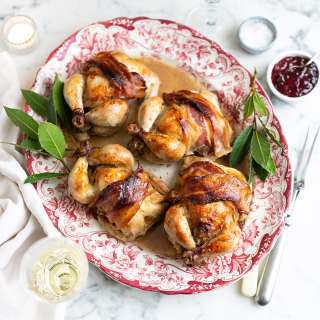 Roast baby chickens with pork, pistachio, and cranberry stuffing