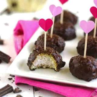 Gluten Free Cheesecake Stuffed Raspberry Coconut Quinoa Bites with Chocolate Glaze