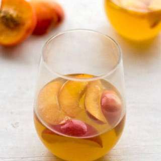 White Wine Cocktail with Peaches and Honey Fig Syrup
