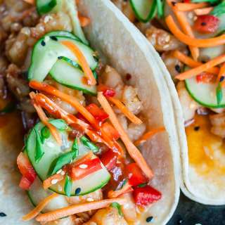 Spicy Szechuan Shrimp Tacos with Cool Cucumber Slaw