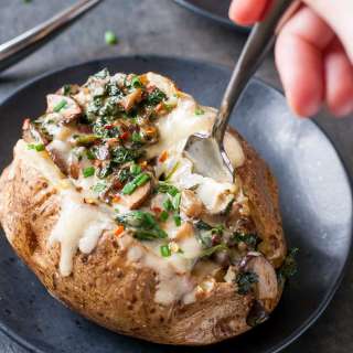 Cheesy Vegetarian Loaded Baked Potatoes with Spinach and Mushrooms