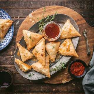 Goat Cheese-stuffed Phyllo Triangles with Hot Honey Drizzle
