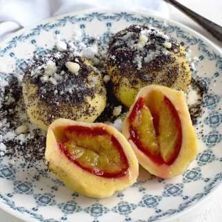 Plum dumplings with poppyseed topping